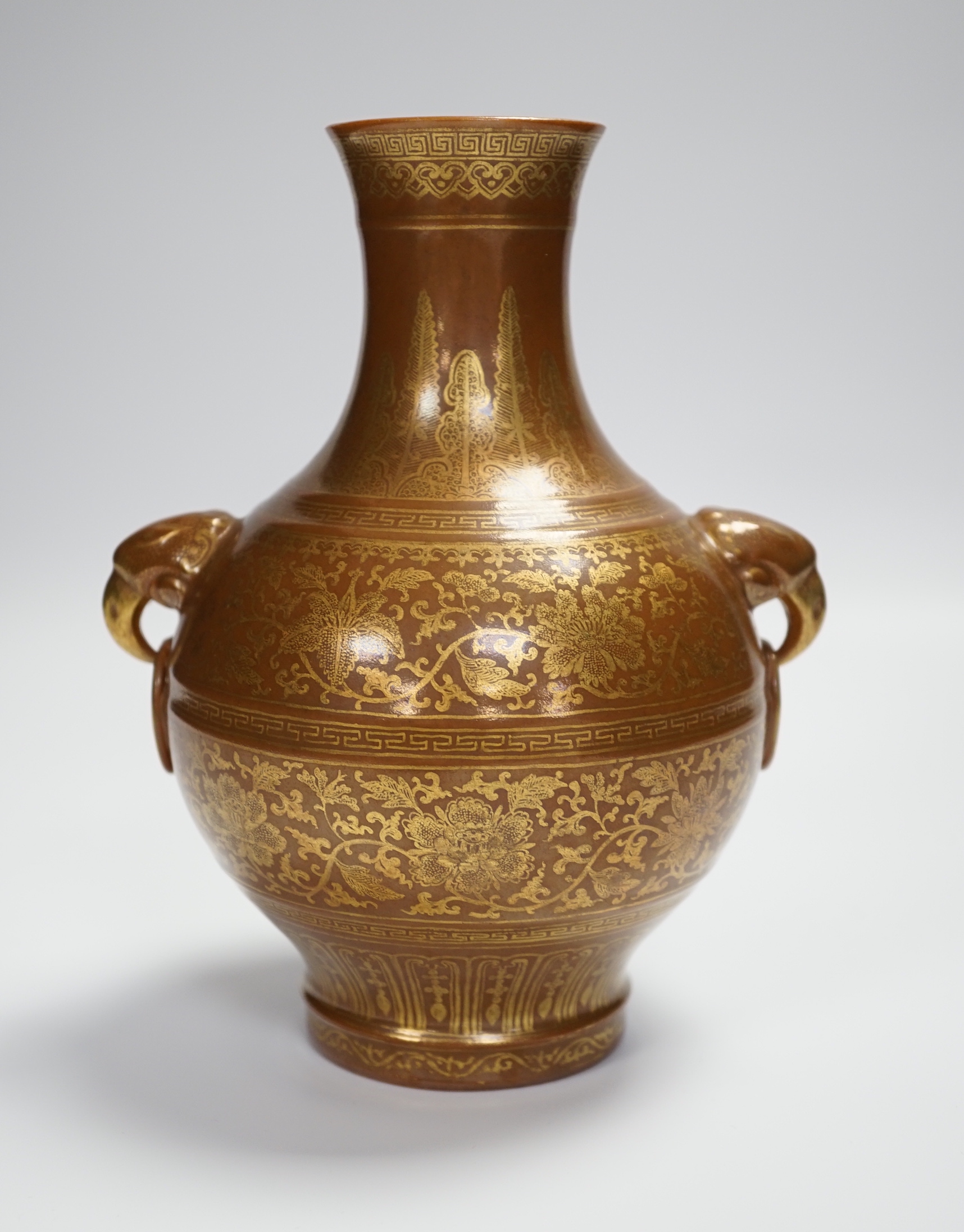 A Chinese porcelain imitation bronze vase, on a brown ground with gilt decoration, 19.5cm high